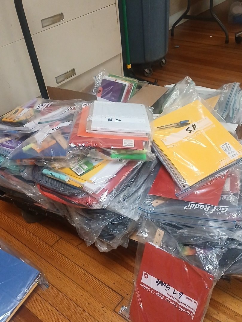 School supplies in bags ready for distribution