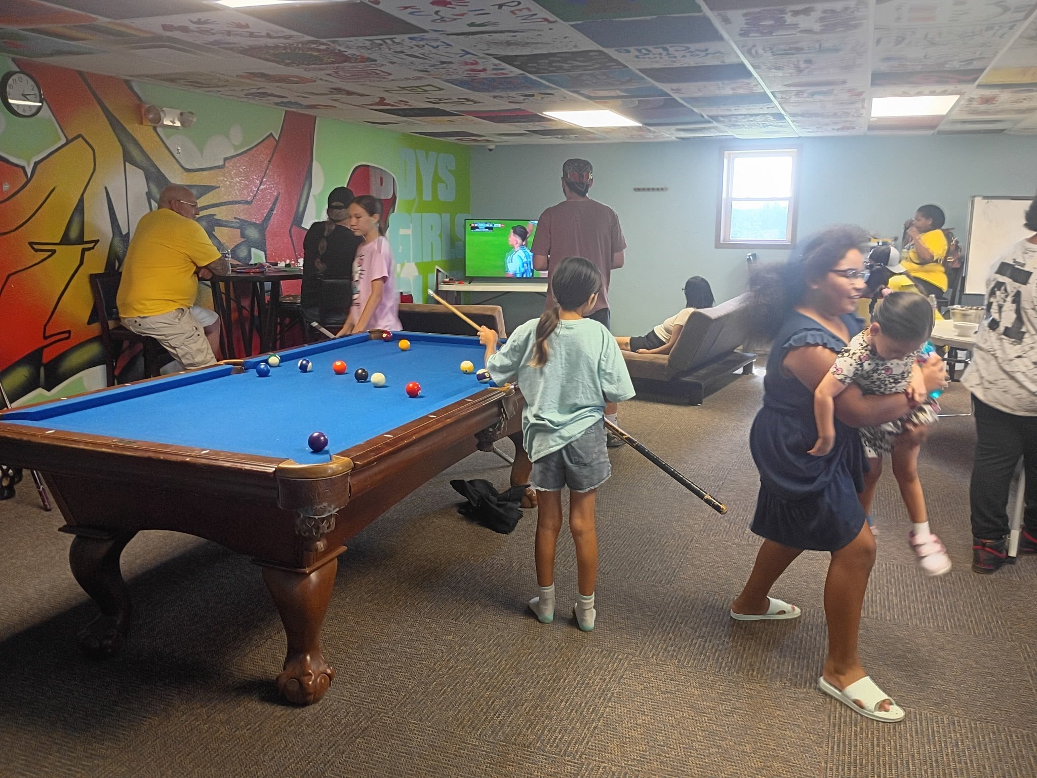 Kids playing pool at the World Cup watch party
